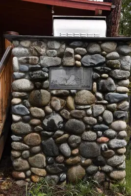 a stone wall with a plaque on it at Half Dome in Wawona