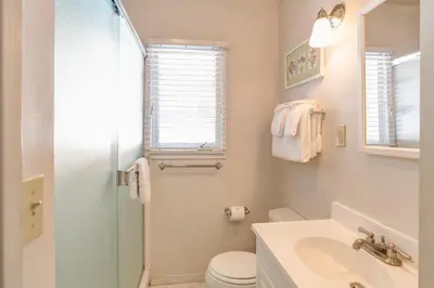 a bathroom with a toilet and a sink and a shower at Ashbaugh Meadow in Wawona