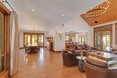 a living room with a couch and a table at 4BR Cabin with Hot Tub – Ultimate Truckee Escape cabin in Truckee