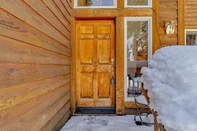 a wooden door on the side of a house at Handcrafted Tahoe Retreat Walk to Beach & Ski in Tahoe City