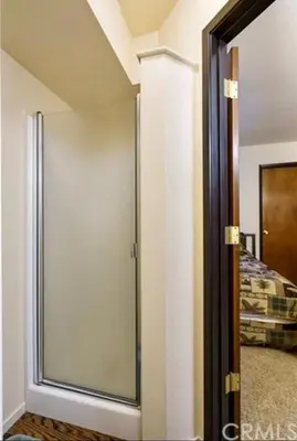a sliding glass door in a room with a bed at ManVee at Yosemite in Fish Camp
