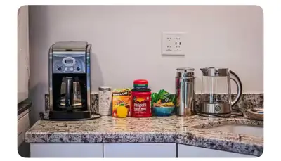 a kitchen counter with a coffee maker on it at Alta Peak House in Three Rivers