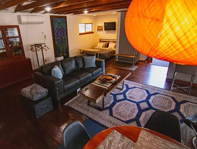 a living room with a couch and a table at Alta Peak Penzion in Three Rivers