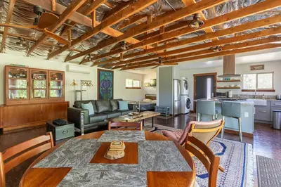 a living room with a table and a couch at Alta Peak Penzion in Three Rivers