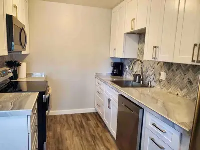 a kitchen with white cabinets and a sink at North Tahoe Escape in Incline Village