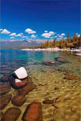 a view of a beach with rocks in the water at North Tahoe Escape in Incline Village
