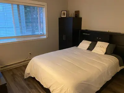 a bedroom with a large white bed with a window at North Tahoe Escape in Incline Village