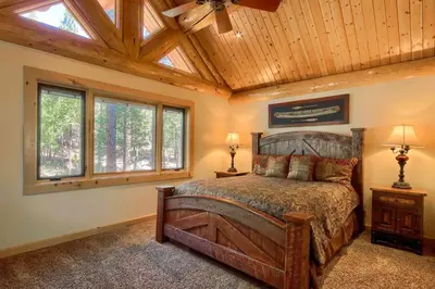 a bedroom with a bed with a wooden ceiling at Yosemite's Luxury Estate at The Redwoods in Yosemite 2349 in Wawona