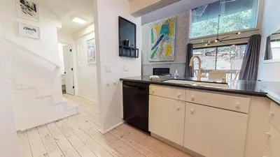 a kitchen with a sink and a counter top at Walk to Canyon Lodge Ski back Modern Space in Mammoth Lakes