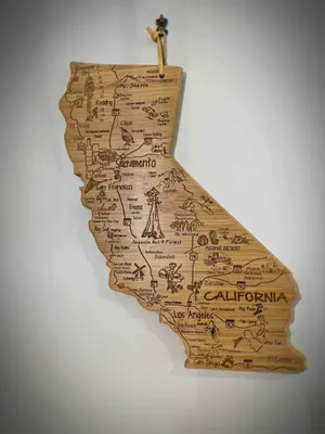 a wooden map of california hanging on a wall at Charming Home, near beautiful park and tennis courts! in Roseville