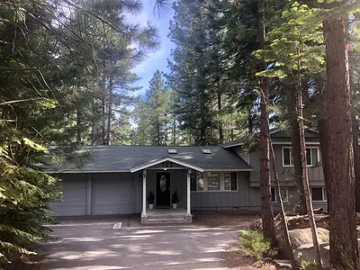 a house with a garage in the middle of trees at 725 Lynda Court Incline Village Nevada USA in Incline Village
