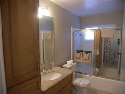 a bathroom with a sink and a toilet and a mirror at 725 Lynda Court Incline Village Nevada USA in Incline Village