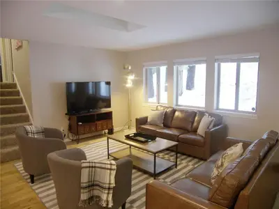 a living room with a couch and a tv at 725 Lynda Court Incline Village Nevada USA in Incline Village