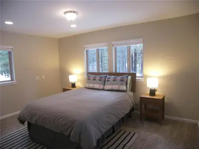 a bedroom with a bed and two lamps on tables at 725 Lynda Court Incline Village Nevada USA in Incline Village