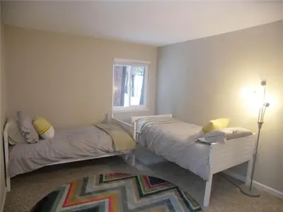a bedroom with two beds and a window at 725 Lynda Court Incline Village Nevada USA in Incline Village