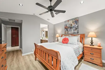 a bedroom with a bed and a ceiling fan at Casita Andrade in Turlock