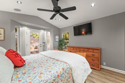 a bedroom with a bed and a ceiling fan at Casita Andrade in Turlock