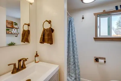 a bathroom with a sink and a mirror at Walk to Beach Dog-Friendly Cabin in Glenbrook! in Glenbrook