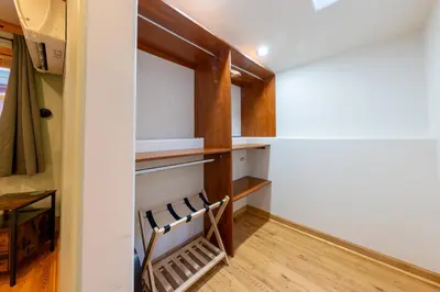 a room with white walls and wooden shelves at Remodeled 4BDR Cabin with AC Lake Views Hot-Tub Bunk Room Excellent Location in Kings Beach