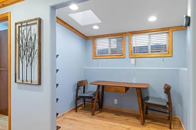 a dining room with a table and chairs at Remodeled 4BDR Cabin with AC Lake Views Hot-Tub Bunk Room Excellent Location in Kings Beach