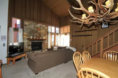 a living room with a couch and a fireplace at Mountainback 19 Loft Den in Mammoth Lakes