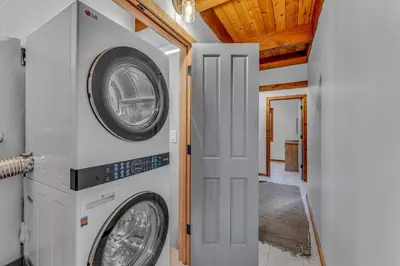 a laundry room with a washer and dryer in a house at Cozy Truckee Vacation Rental with Fireplace & Deck in Truckee