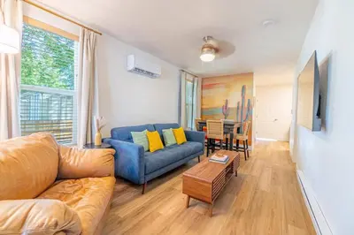 a living room with a couch and a table at Charming Family 2BR Midtown Reno - Pets Welcome in Reno
