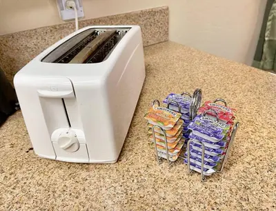 a white toaster sitting on a counter next to some chips at Bear Chalet - Snow Play - 4 Bedrooms - Foosball in South Lake Tahoe