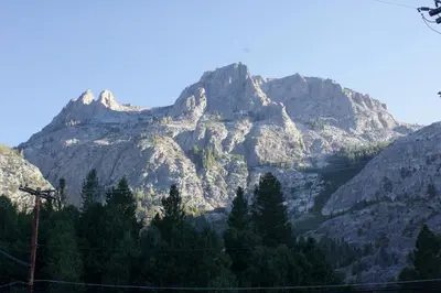 a mountain range with trees in front of it at Whispering Pines in June Lake