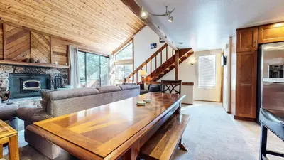 a living room with a couch and a table at Mammoth Sierra Townhomes #38 condo in Mammoth Lakes