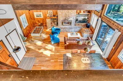 an overhead view of a living room with wood floors at Cozy Carnelian Bay Escape with Deck and Foosball in Carnelian Bay