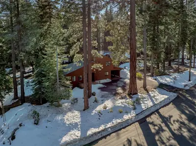 an aerial view of a cabin in the woods at Cozy Carnelian Bay Escape with Deck and Foosball in Carnelian Bay