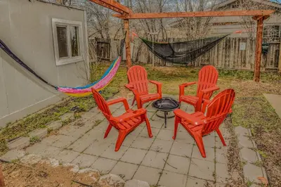 four chairs and a table with a hammock in a backyard at Reno Retreat 3 King Beds by Casinos and University in Reno