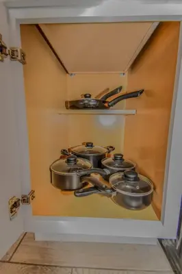 a set of pots and pans in a small kitchen at Reno Retreat 3 King Beds by Casinos and University in Reno