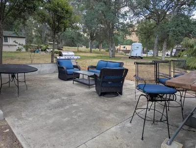 a group of chairs and tables in a park at Squaw Valley Motel Room #1 in Squaw Valley