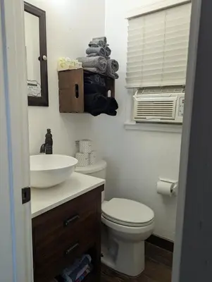 a bathroom with a white toilet and a sink at Squaw Valley Motel Room #1 in Squaw Valley