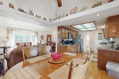 a kitchen and living room with a table and chairs at Casa Cardoso in Groveland