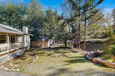 an empty yard next to a house with trees at Casa Cardoso in Groveland
