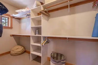 a walk in closet with white shelves at Deluxe Truckee Townhome 3BDR Dog Friendly Great Location in Truckee