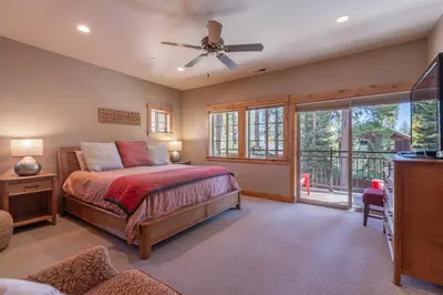 a bedroom with a bed and a ceiling fan at Deluxe Truckee Townhome 3BDR Dog Friendly Great Location in Truckee