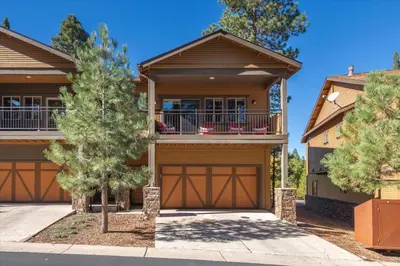 a house with a garage in front of it at Deluxe Truckee Townhome 3BDR Dog Friendly Great Location in Truckee