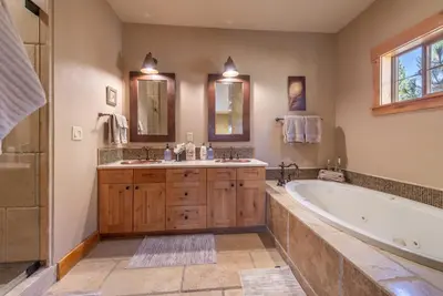 a large bathroom with a tub and a sink at Deluxe Truckee Townhome 3BDR Dog Friendly Great Location in Truckee
