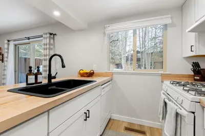 a kitchen with a sink and a stove at Cozy Condo for 8 Hot-Tub HOA Amenities Walk to Beach Close to Slopes in Tahoe City