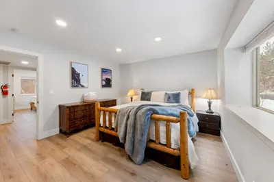 a bedroom with a large bed and a window at Cozy Condo for 8 Hot-Tub HOA Amenities Walk to Beach Close to Slopes in Tahoe City