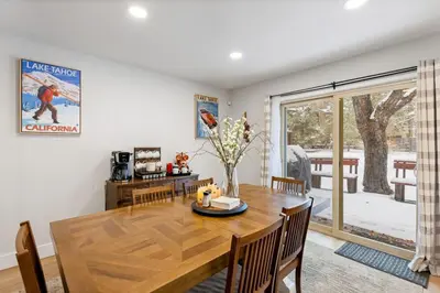 a dining room with a table and chairs and a window at Cozy Condo for 8 Hot-Tub HOA Amenities Walk to Beach Close to Slopes in Tahoe City
