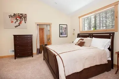 a bedroom with a large bed and a window at Luxury Home Near Lake, Heavenly, Casinos in South Lake Tahoe