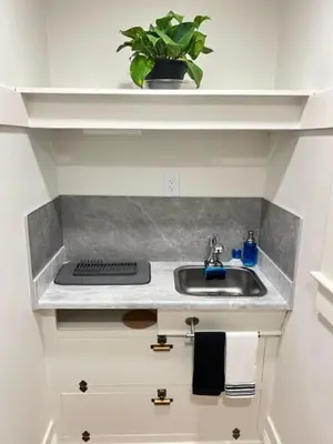 a kitchen counter with a sink and a potted plant at Reno MidTown Movie House in Reno