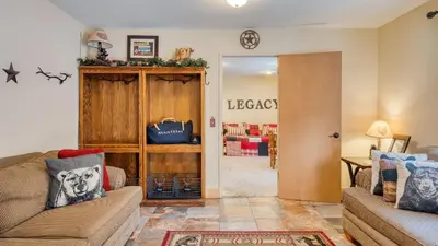 a living room with a couch and a table at Mountain Cabin w Fireplace Balcony Easy Ski Access Bear Americana in Truckee
