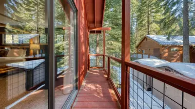 a view from the balcony of a cabin at Mountain Cabin w Fireplace Balcony Easy Ski Access Bear Americana in Truckee