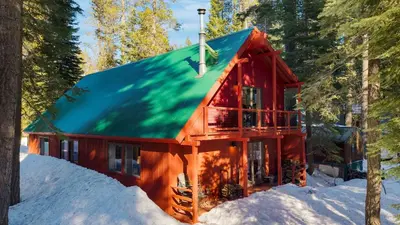 a red cabin with a green roof in the snow at Mountain Cabin w Fireplace Balcony Easy Ski Access Bear Americana in Truckee